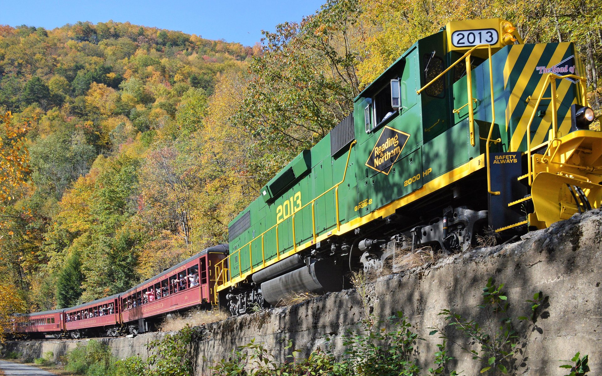 The Lehigh Gorge Scenic Railway train running through autumn foliage near Jim Thorpe, Pennsylvania